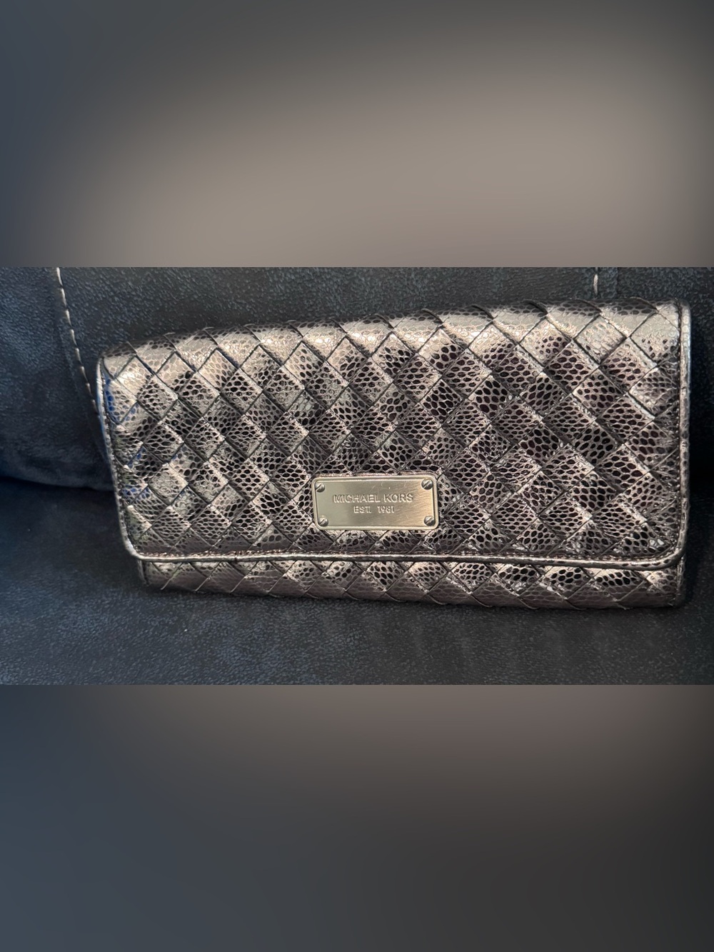 Michael Kors Metallic Gunmetal Woven Leather clutch.